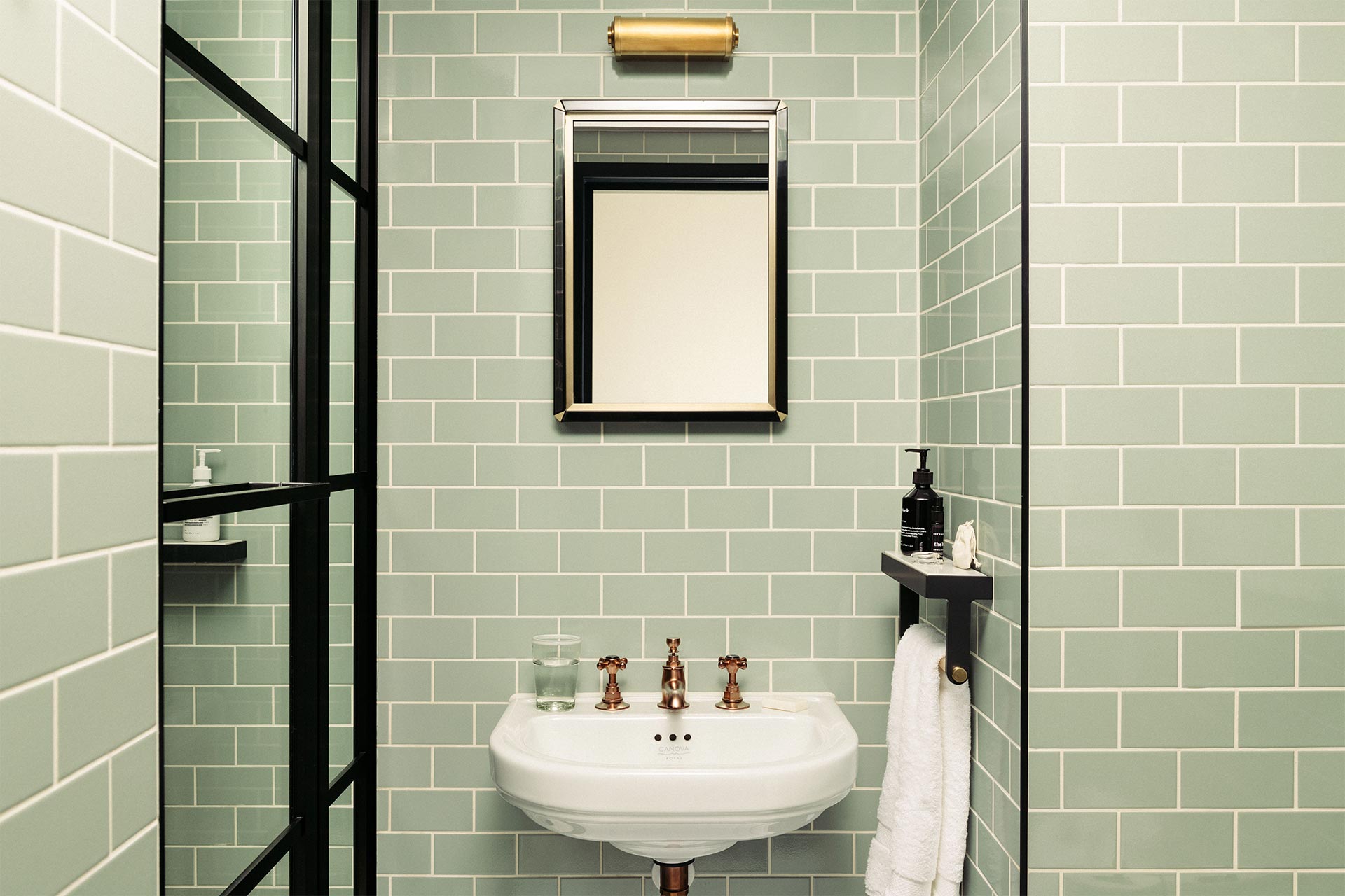Bathroom in Southwark with green tiles
