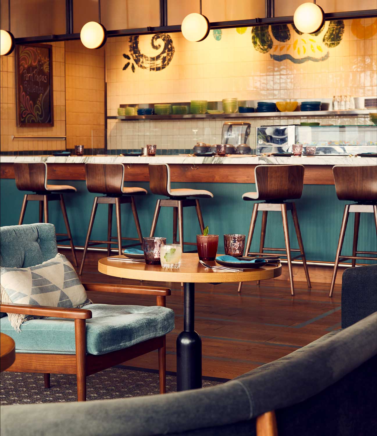 The restaurant has a mix of different seating, from comfortable lounge chairs and booths to high bar stools