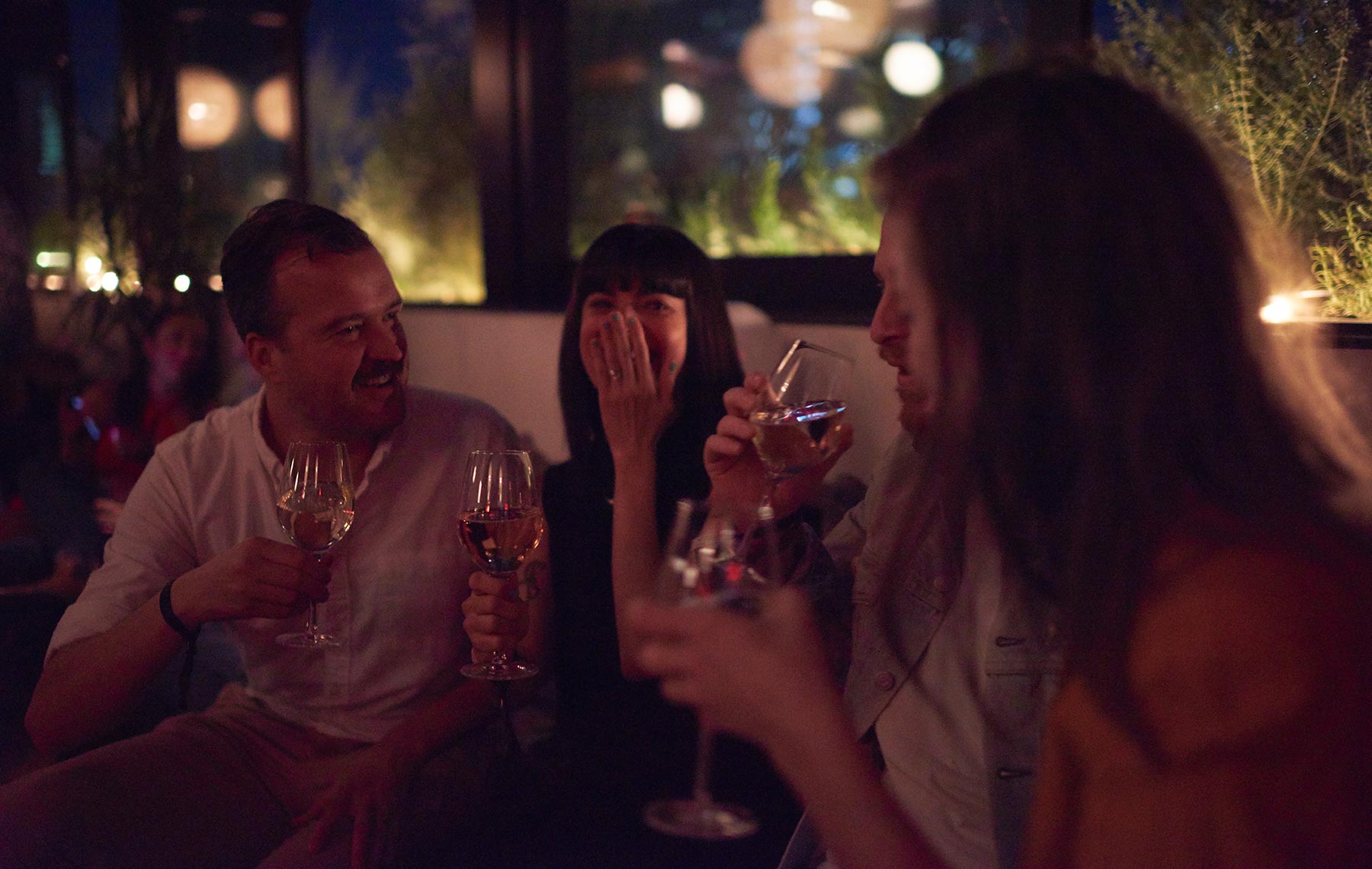 Smiles and drinks at an event