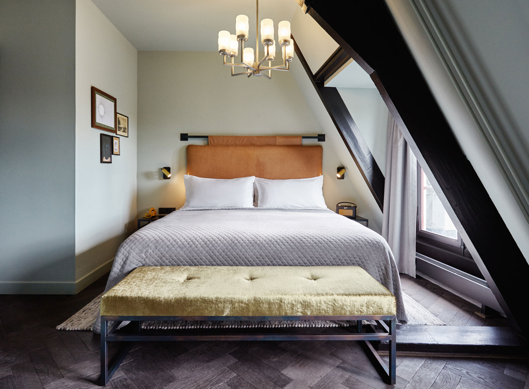 Bed in hotel room, top floor