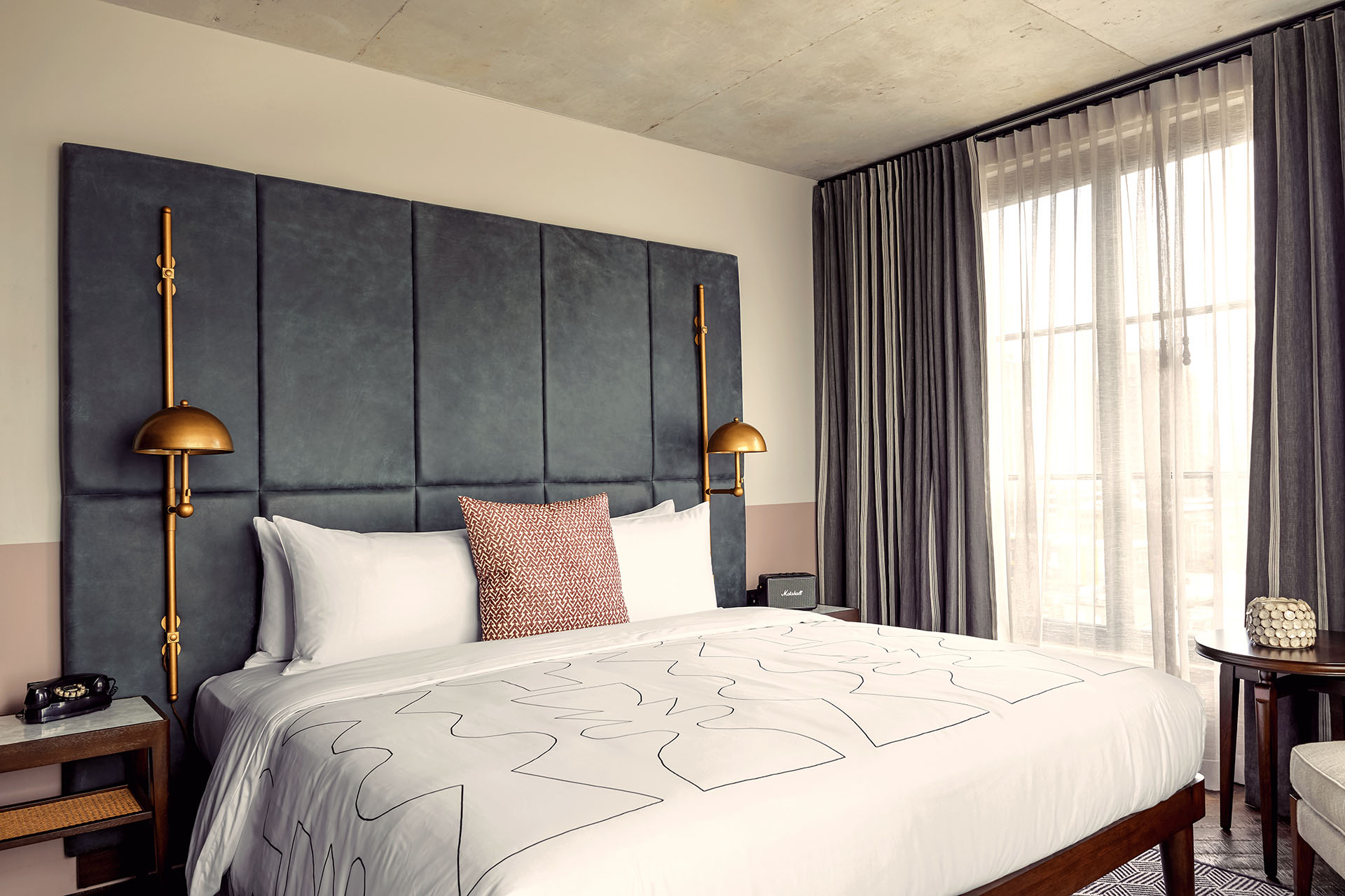 The Roomy bedrooms have a King sized bed with a dark grey coloured headboard