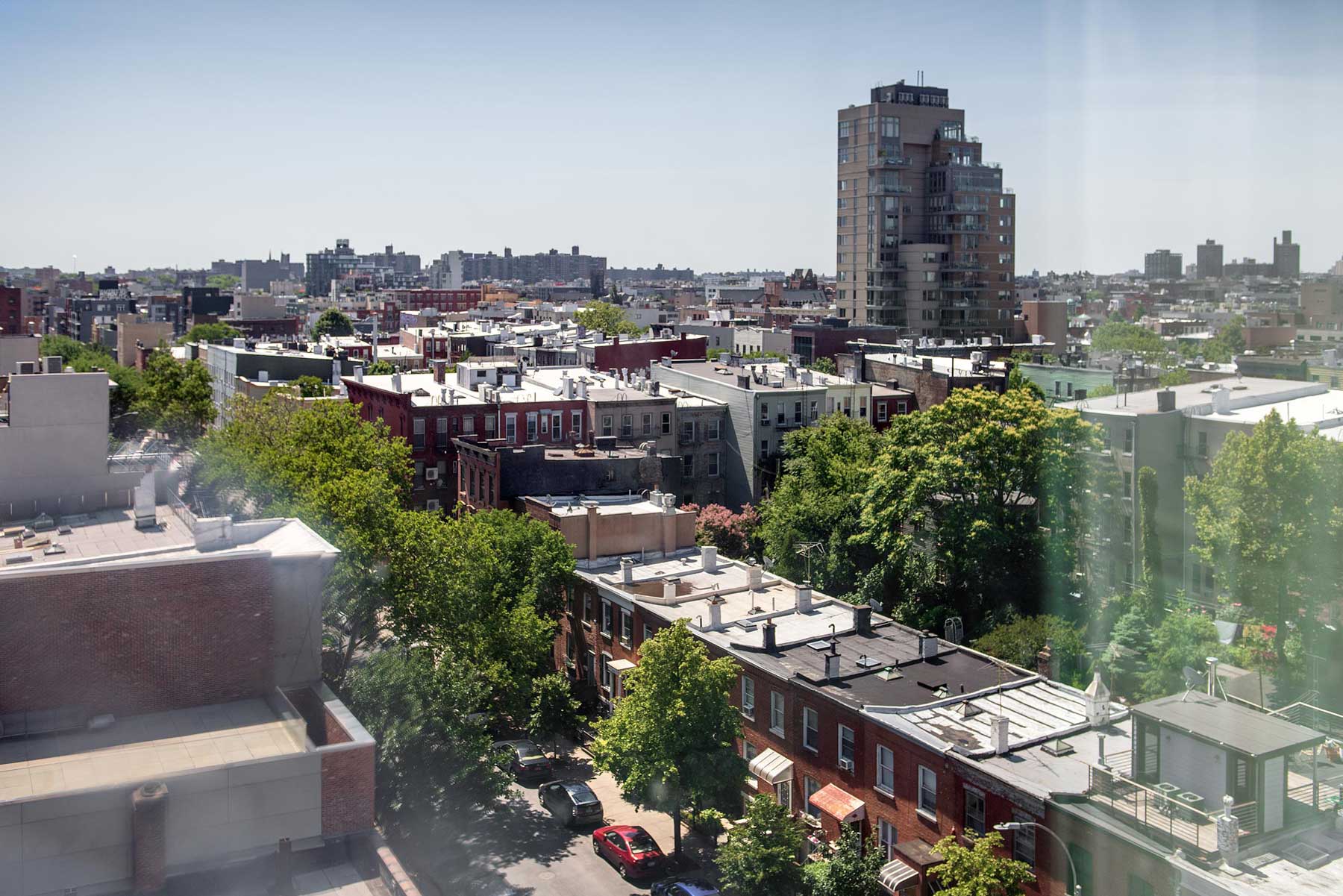 An alternative view of Brooklyn, with green leafy trees between buildings
