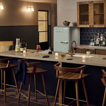 Pantry kitchen set up for guests in the evening, with cocktails and wine bottles on the side