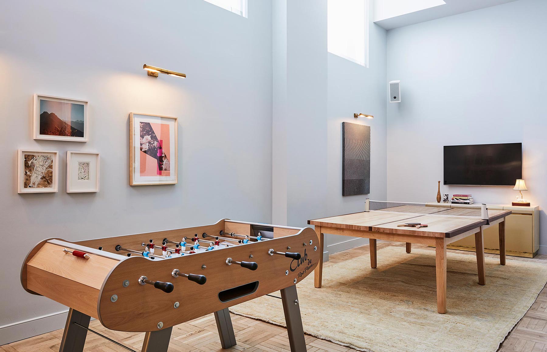 The Play Room includes both a foosball table and a table tennis table