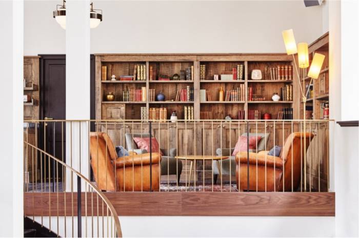 Amsterdam Mezzanine level with bookcases and armchairs