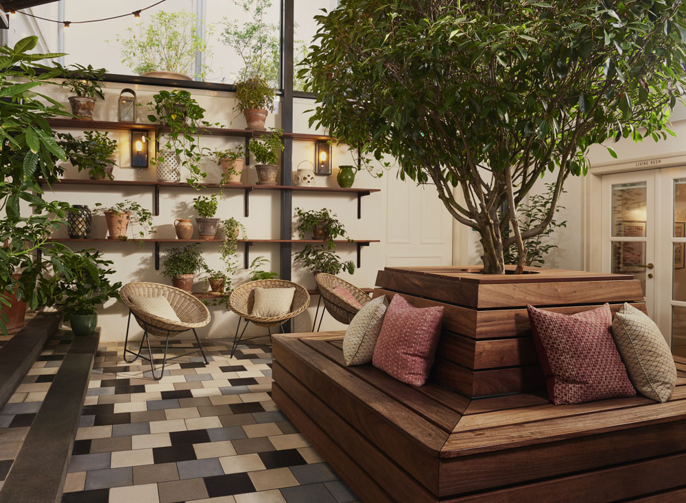 Seating, floor tiles and plants in the courtyard