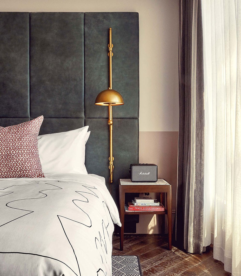 Marshall bluetooth speaker beside bed