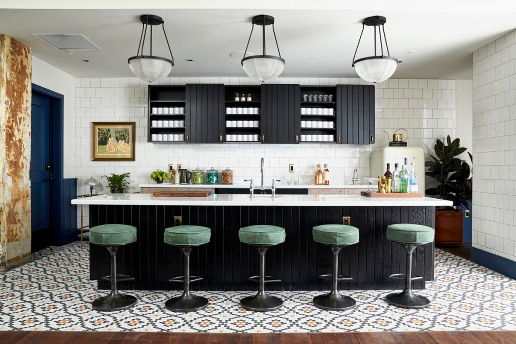 Pantry area, with five green coloured bar stools in front of the kitchen island