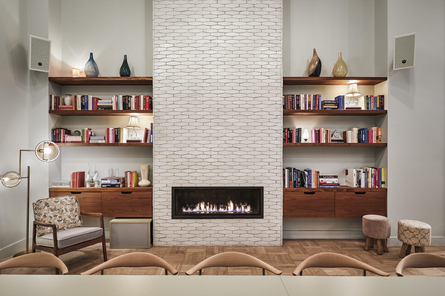 The room looks more like someone's lounge than an events space - with a fireplace, bookshelves and comfortable seating