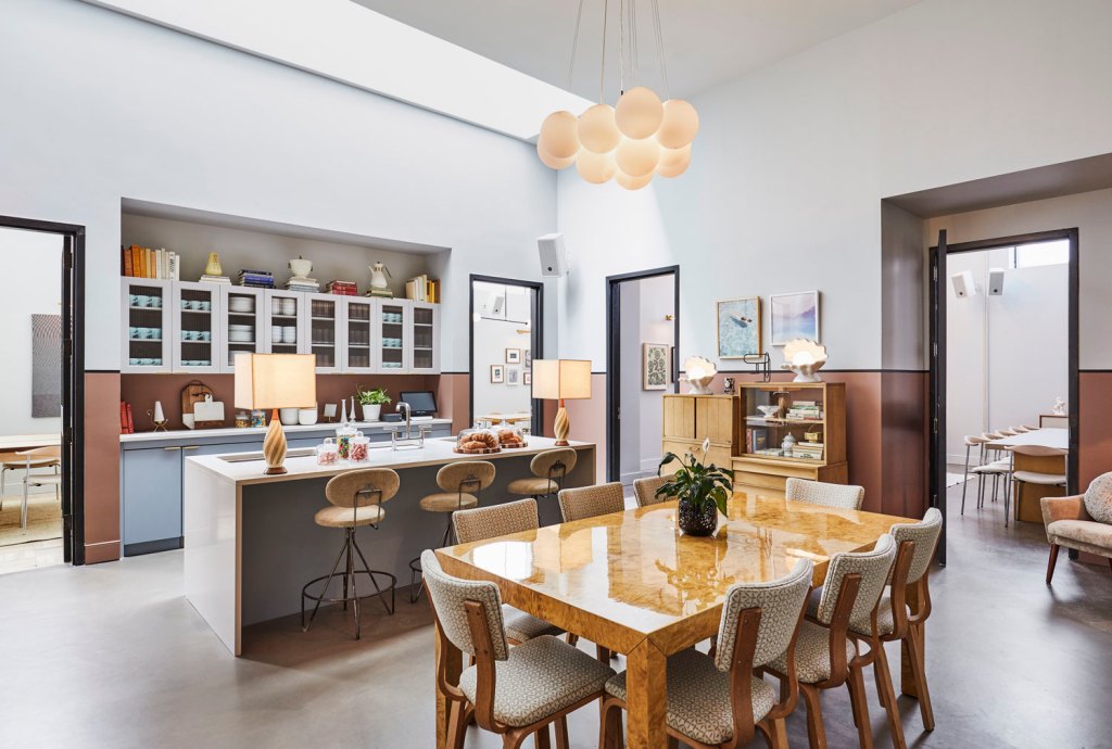 The open-plan Pantry interior has a clean, homely feel with kitchen counter and dining table.