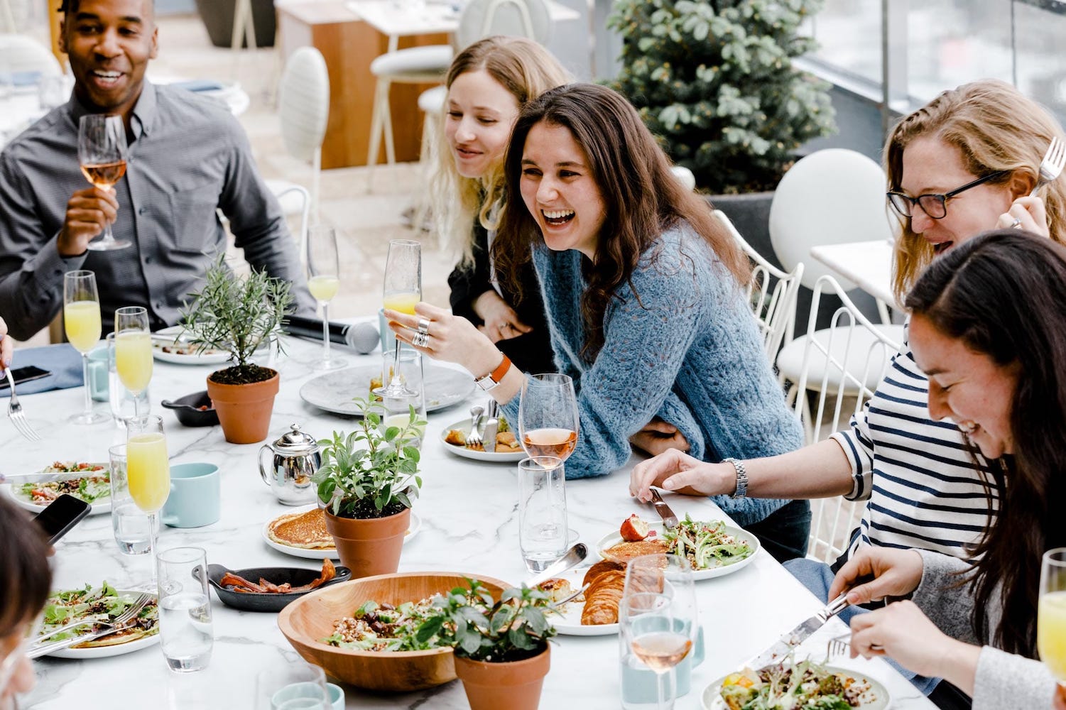Laughing friends having lunch