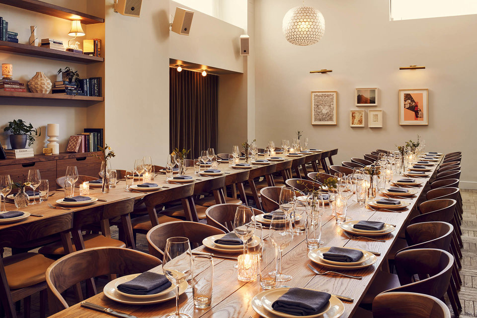 A large room more suitable to large private dining events, with two very long tables