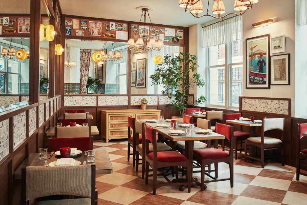 The nostalgic setting of Moonlark's Dinette features well-set tables, a classic checkered floor, and an interior color palette that complements the overall atmosphere.