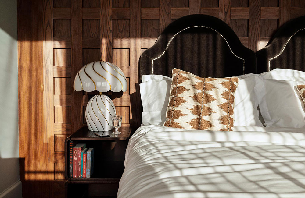 Books about Rome sit beside the hotel bed