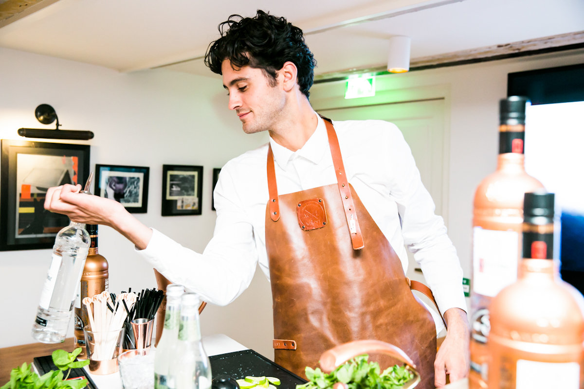 Bartender making drinks at a party