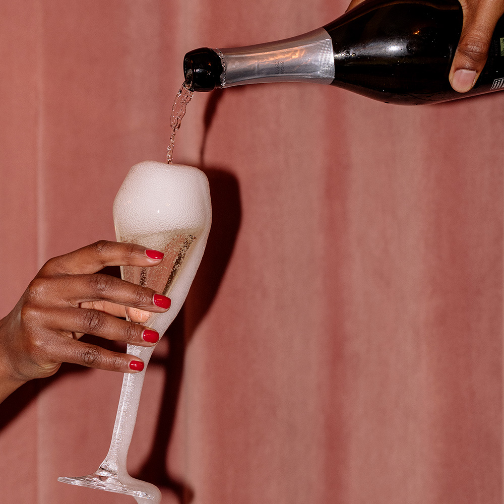 Champagne being poured into a glass flute