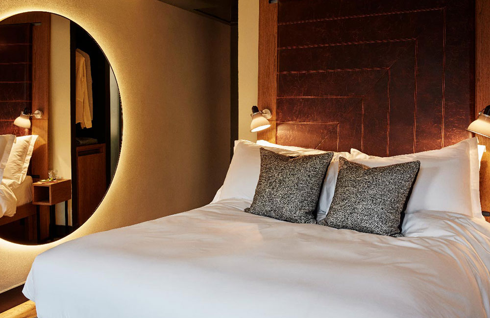 A large leather headboard is a big feature of the room