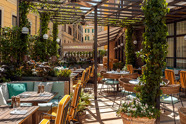 Elio terrace, with several tables and chairs.