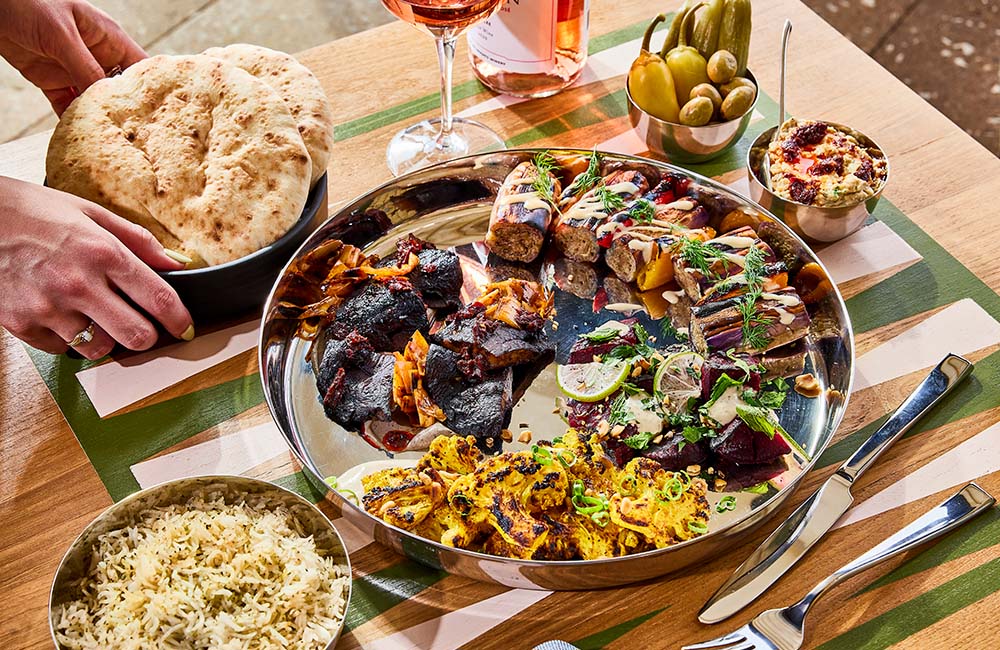 Laser Wolf grilled meats with salatim and pita sides