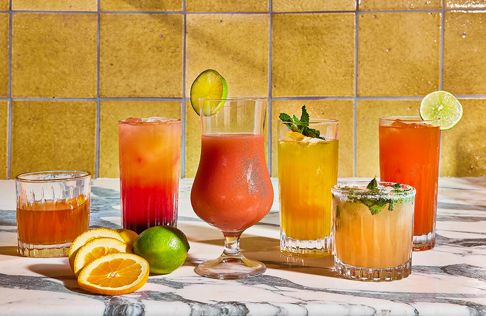 Variety of cocktails that are all orange and yellow colours