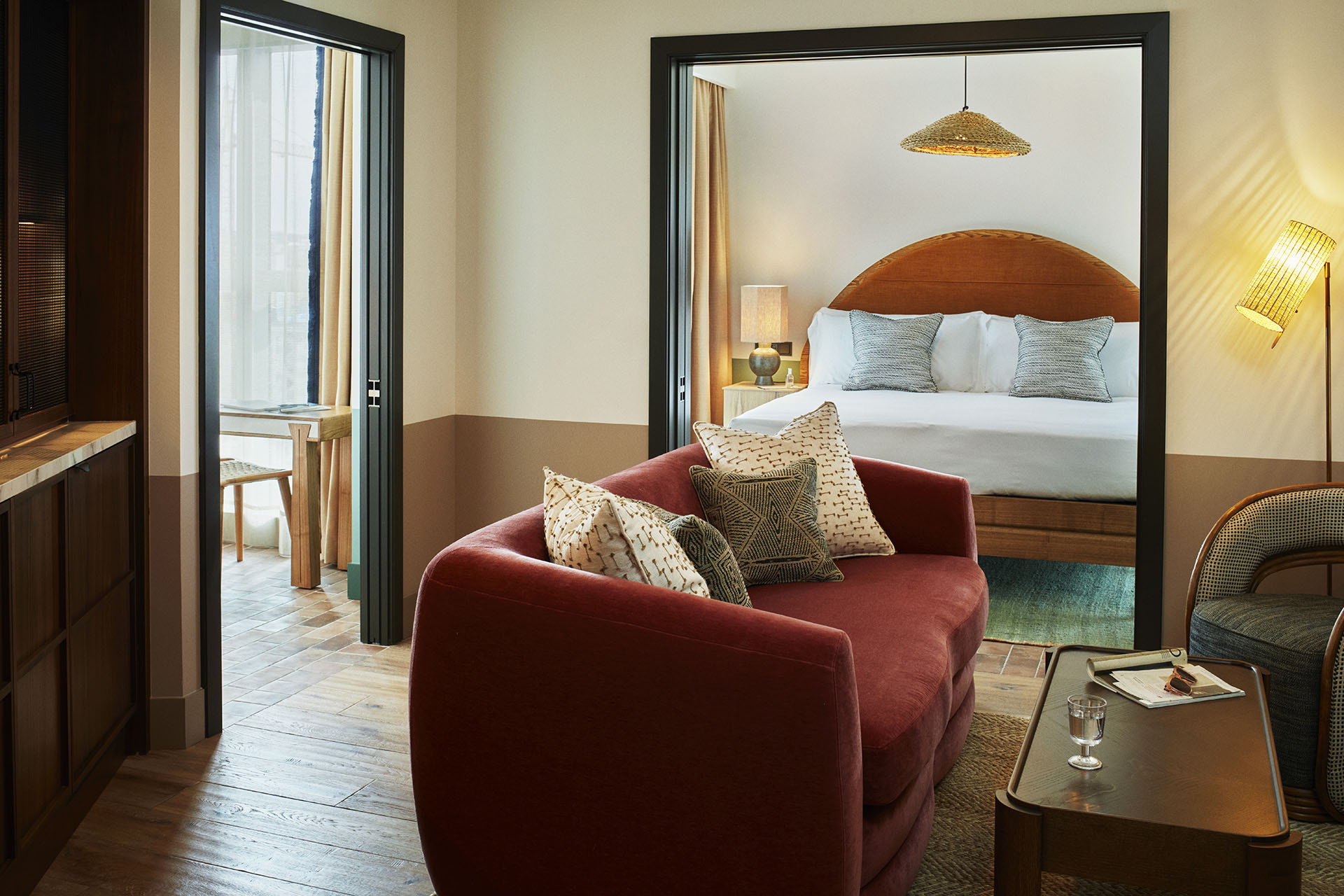 In the centre of the apartment is a lounge area with sofa and coffee table