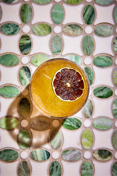 Birds-eye view of a cocktail with a slice of sugared lime.