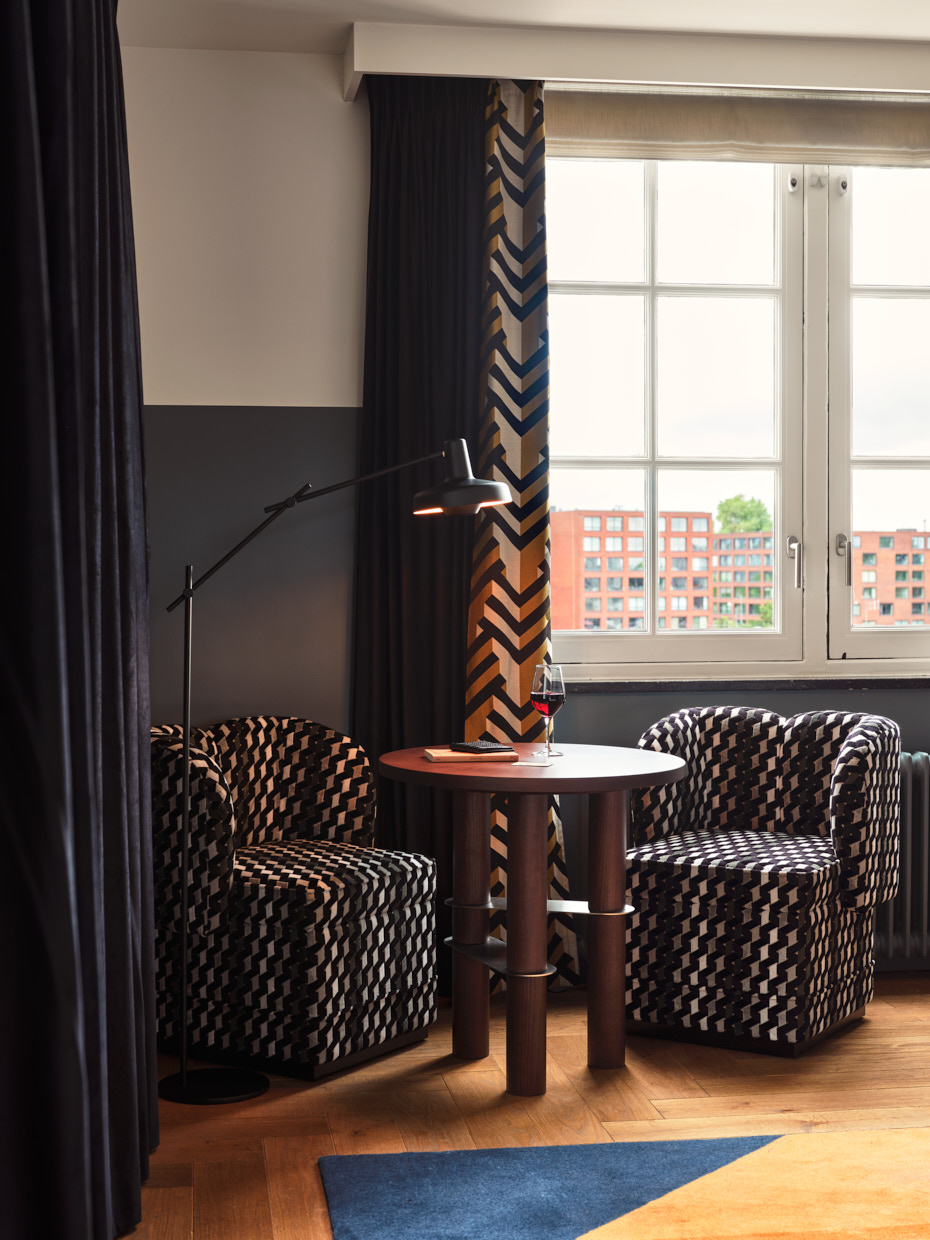 Coffee table with chairs beside window