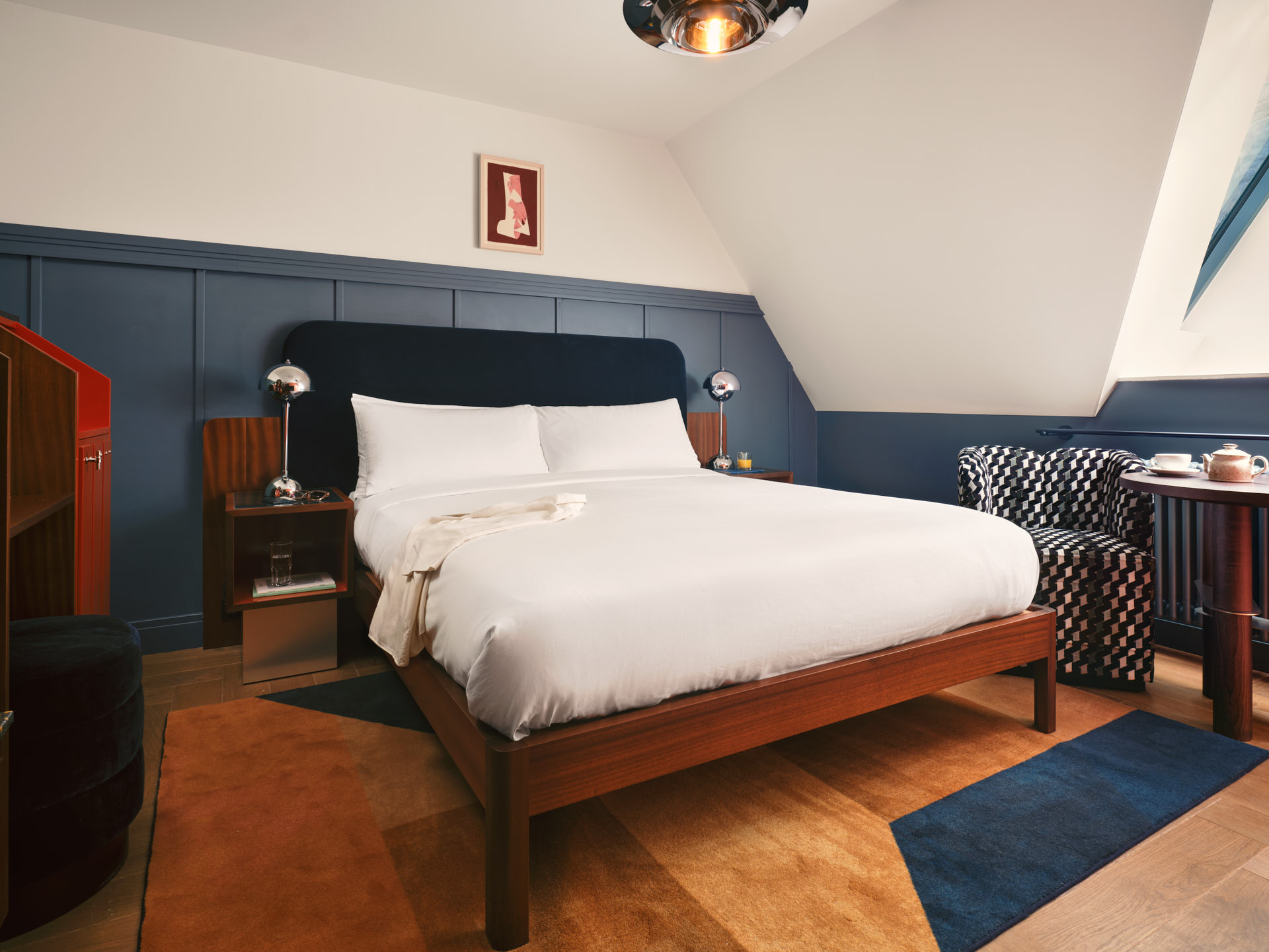 Interior of Cosy room showing wide shot of bed
