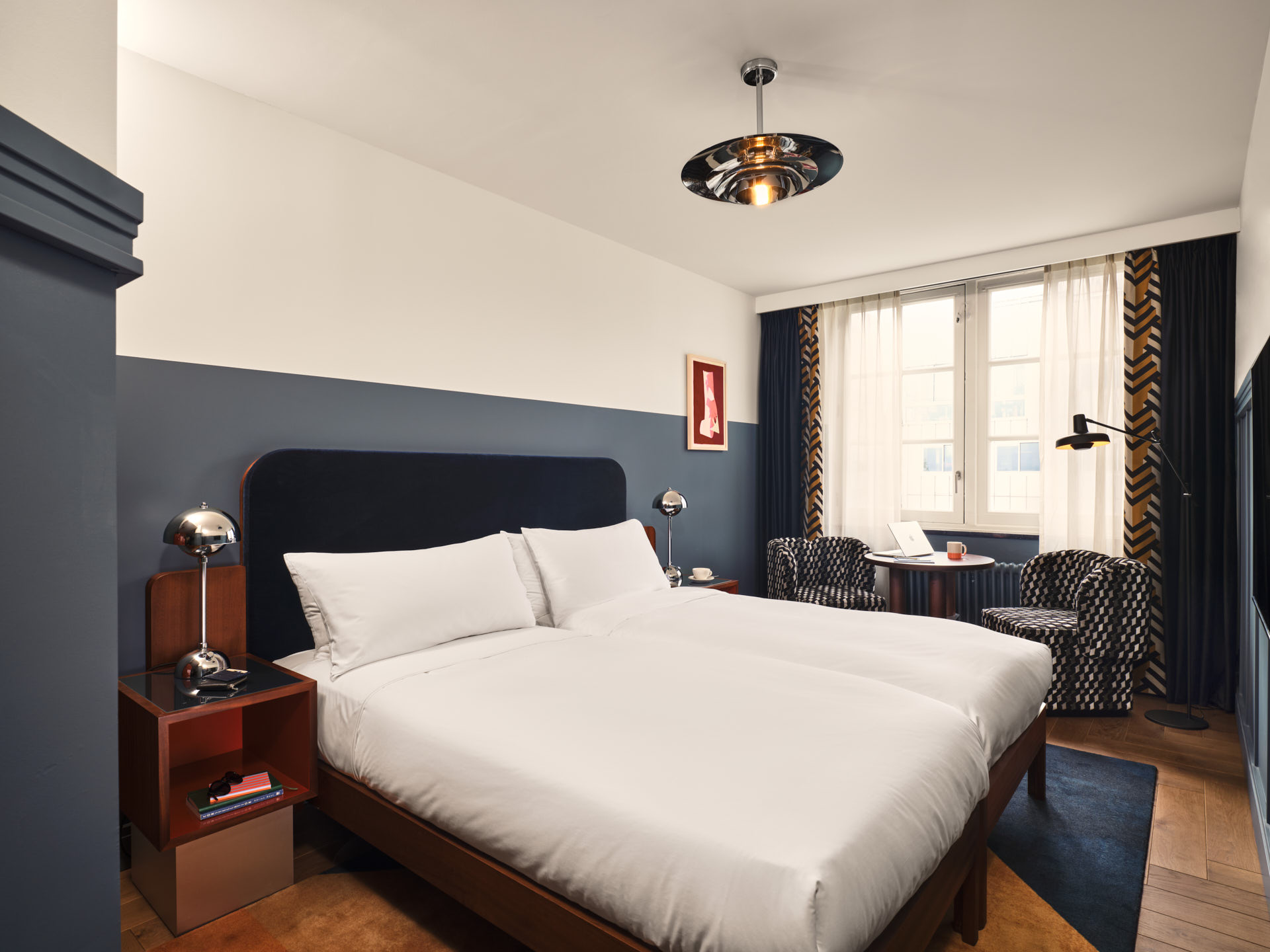 Wide shot Roomy Twin room showing twin beds and lots of natural light