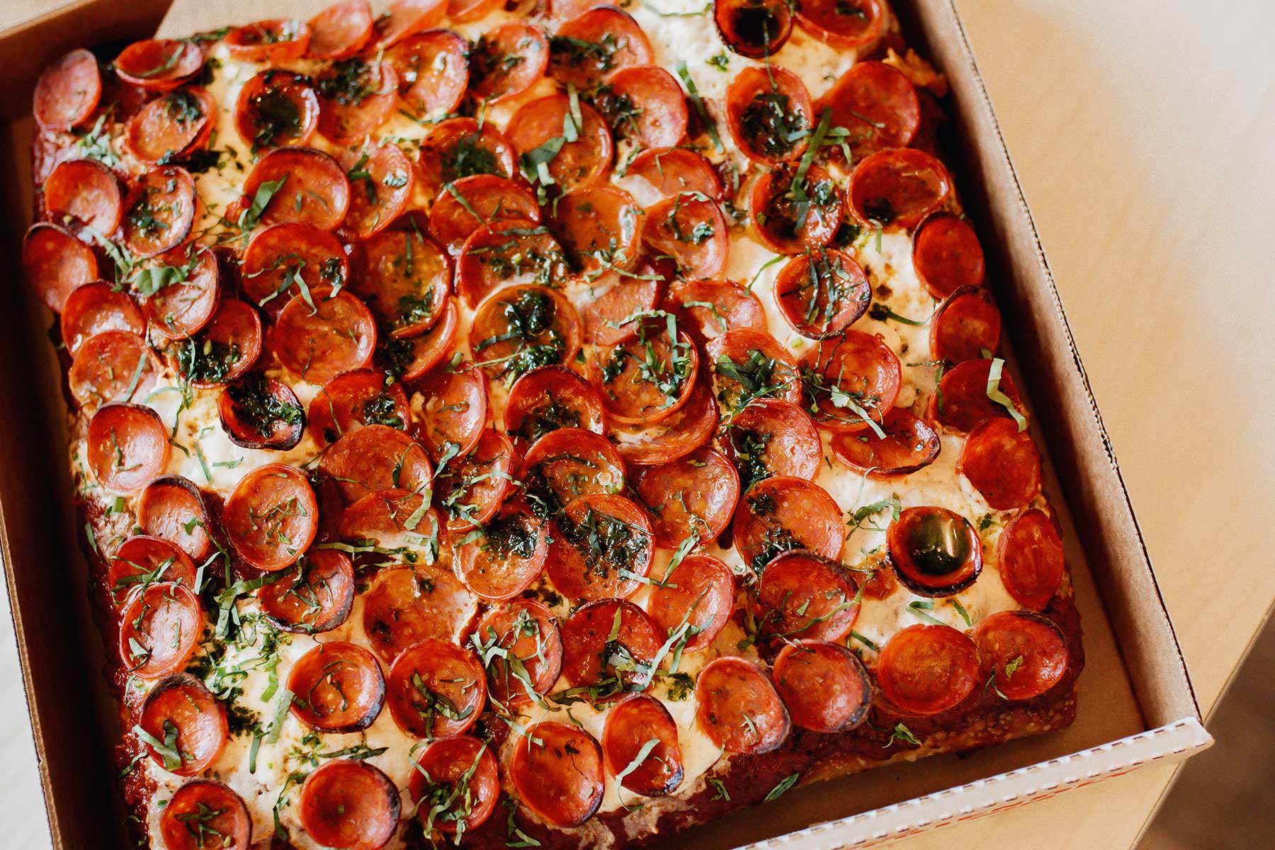 Deep dish pizza with mozzarella and pepperoni.