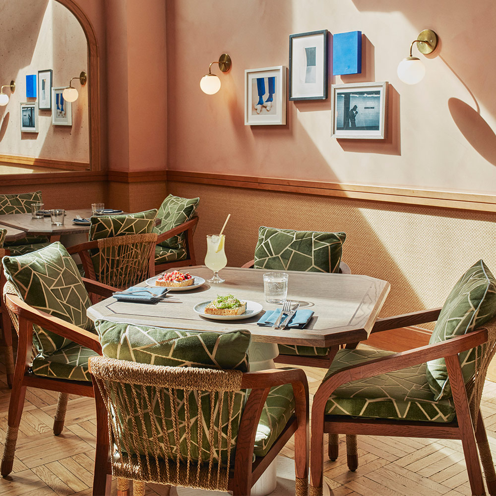 Table and chairs arranged for dining at Laser Wolf restaurant.