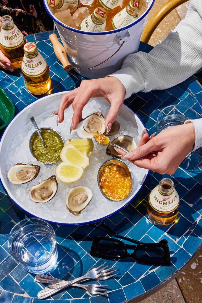 Oysters served with lemon on a bed of ice.