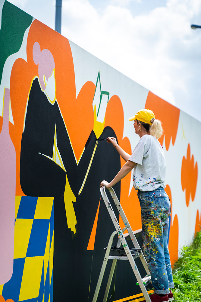 Muralist Perrine Honoré paints her latest mural.