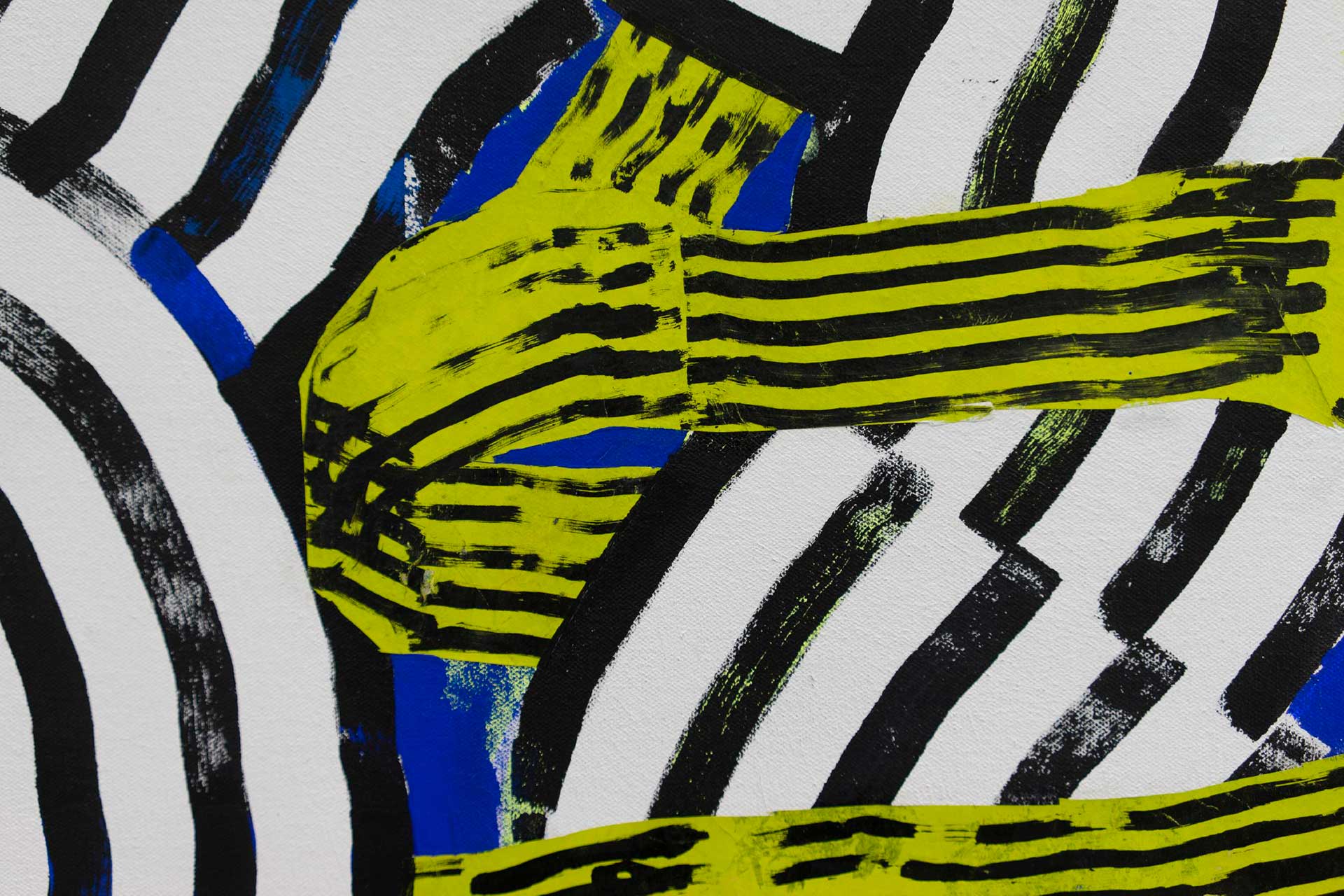 Detail of a striped design in white, black, yellow and blue