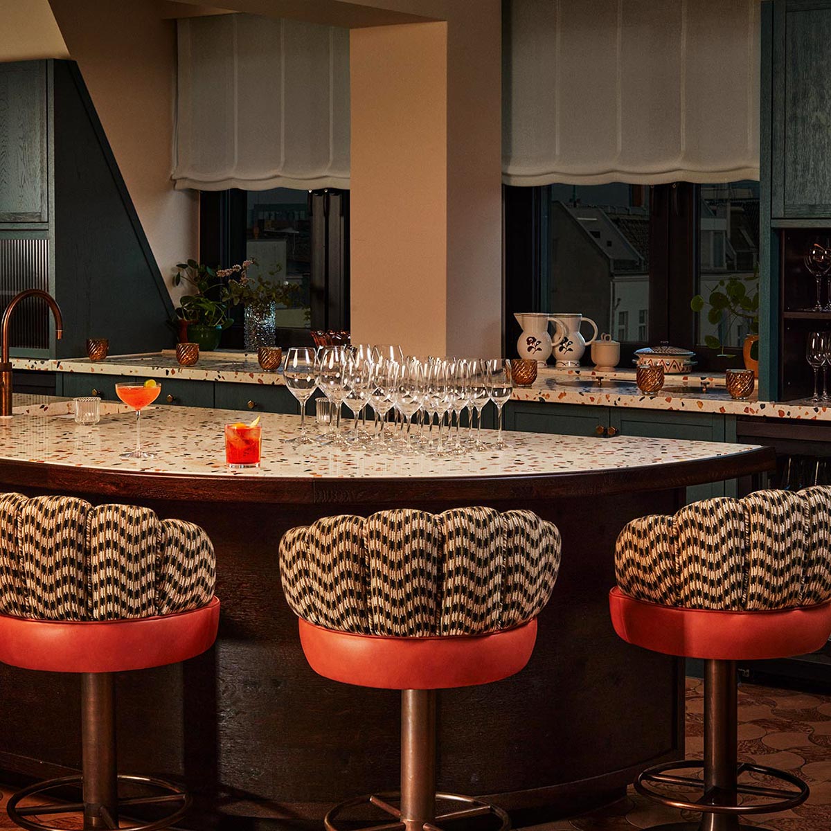Champagne glasses laid out for a celebration in the Pantry at The Hoxton, Charlottenburg