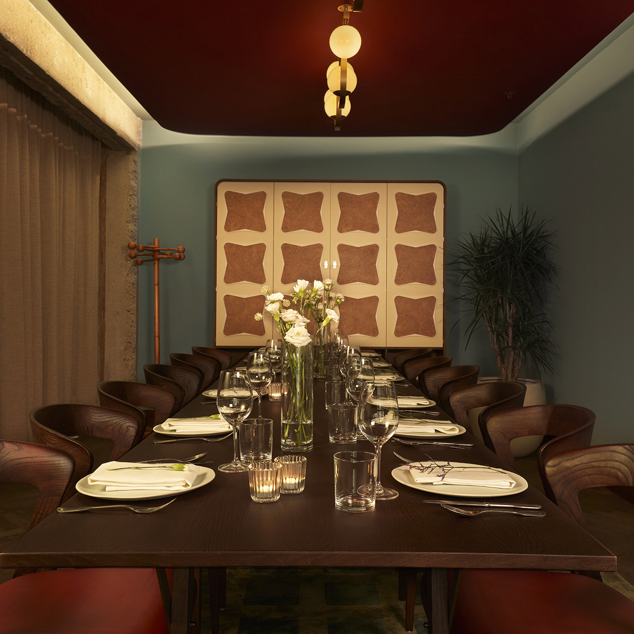 Dining room laid out for a private dining experience for twelve people.