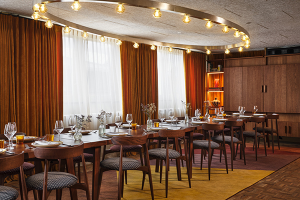 Dining room with a long table laid out for a meeting or dinner