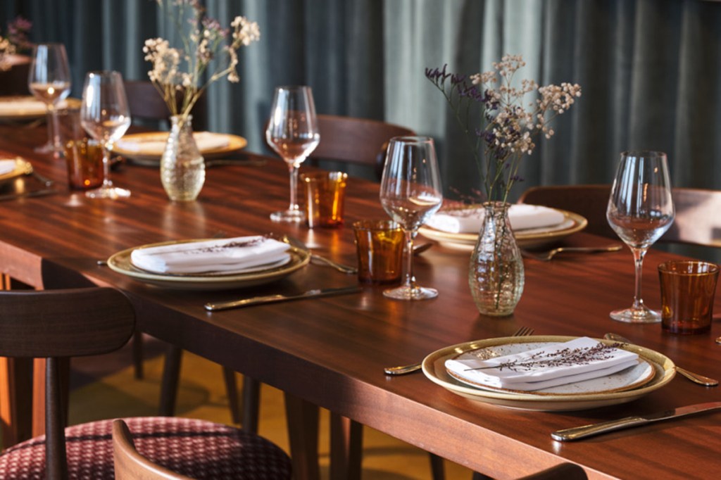Close up of dining places on a polished wooden table