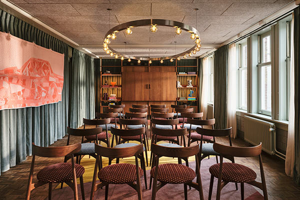 Chairs arranged theatre-style facing a space for a speaker