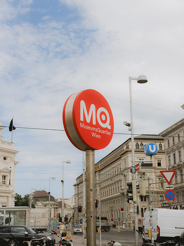 Red circular sign outside the Museum Quartier
