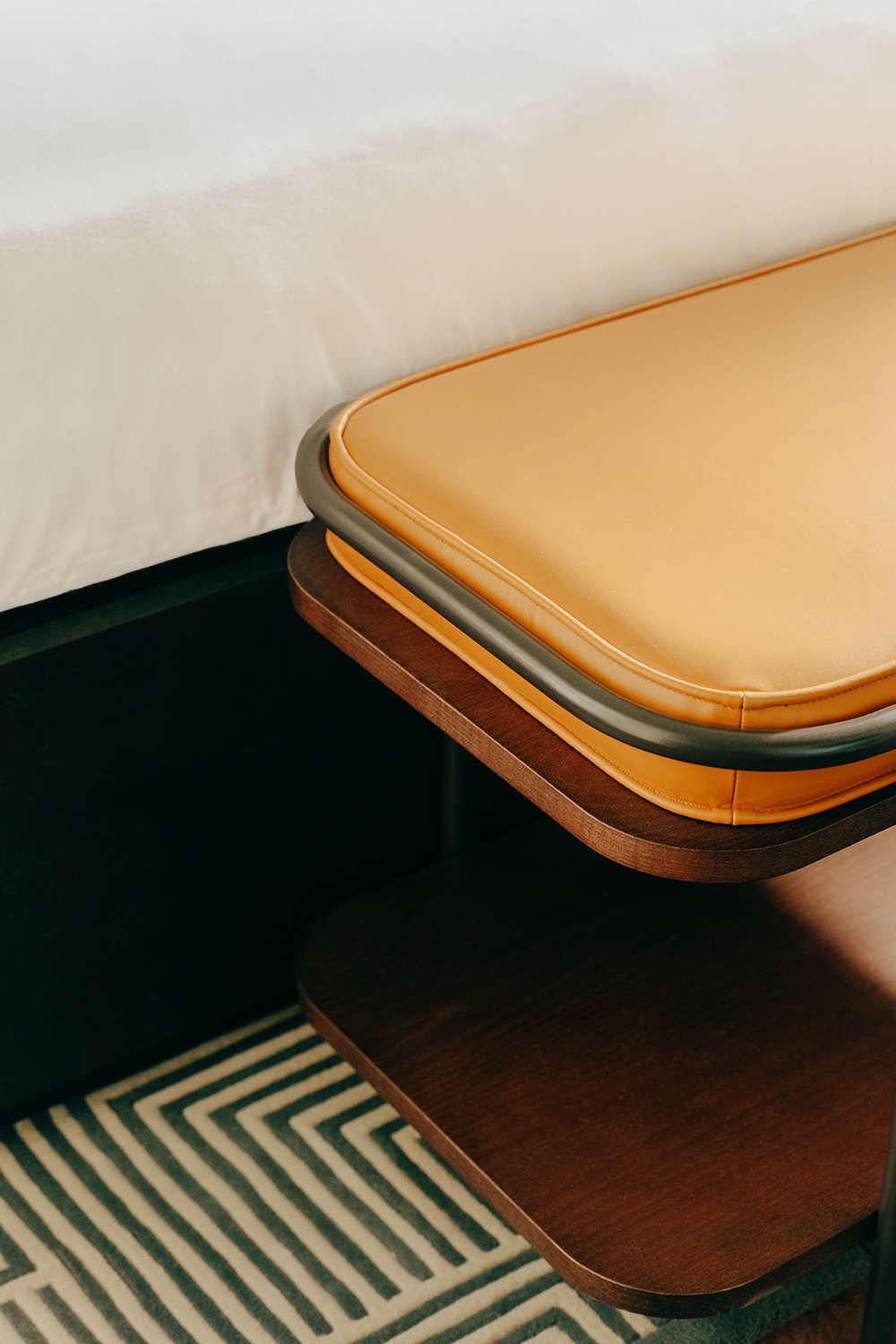 Smooth edge of a cushioned footstool