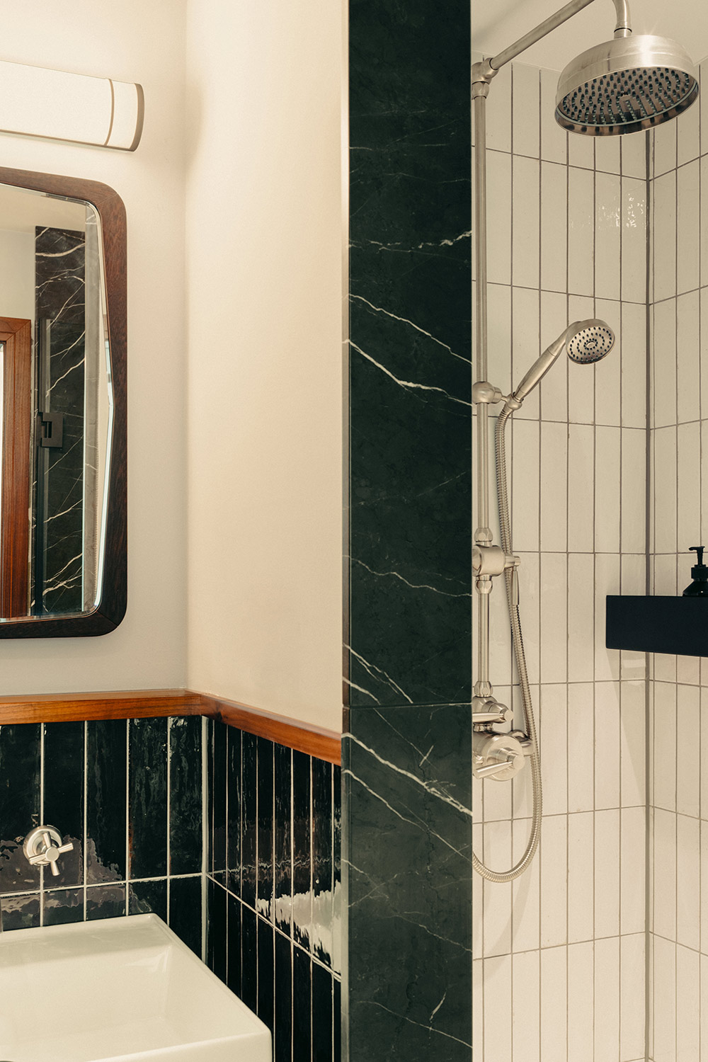 Shower and sink with marble tiles