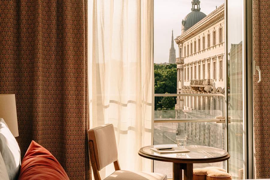 View of Vienna through an open window at Hoxton Vienna