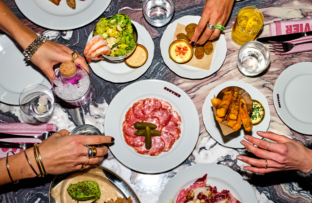 A ray of started dishes on marble table.