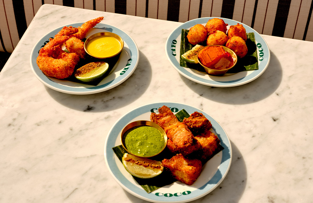3 started dishes on a marble table.