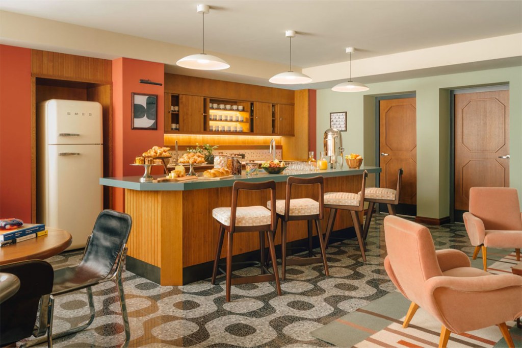 View of the kitchen island with barstool in the pantry.