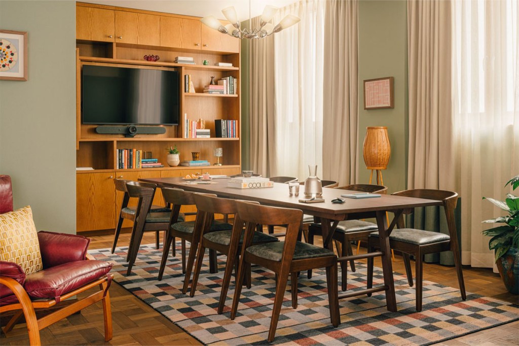 Long boardroom table with chairs.
