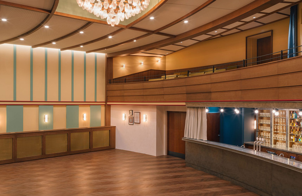 View of the auditorium, balcony and large chandelier.
