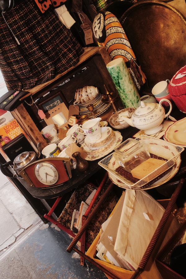 Photos by Ben Hickman. Several different objects displayed on a table inside Gong Nong Bing Vintage store. The Localist - Hoxton Hotels.