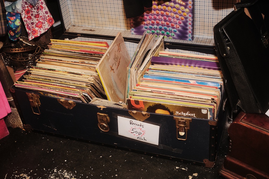Photos by Ben Hickman. A trunk with several vinyl records - The Localist, Hoxton Hotels.